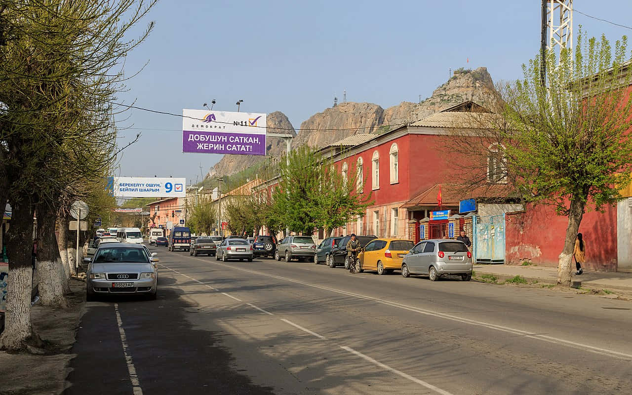 Gapar Aitiev Street In Osh Background