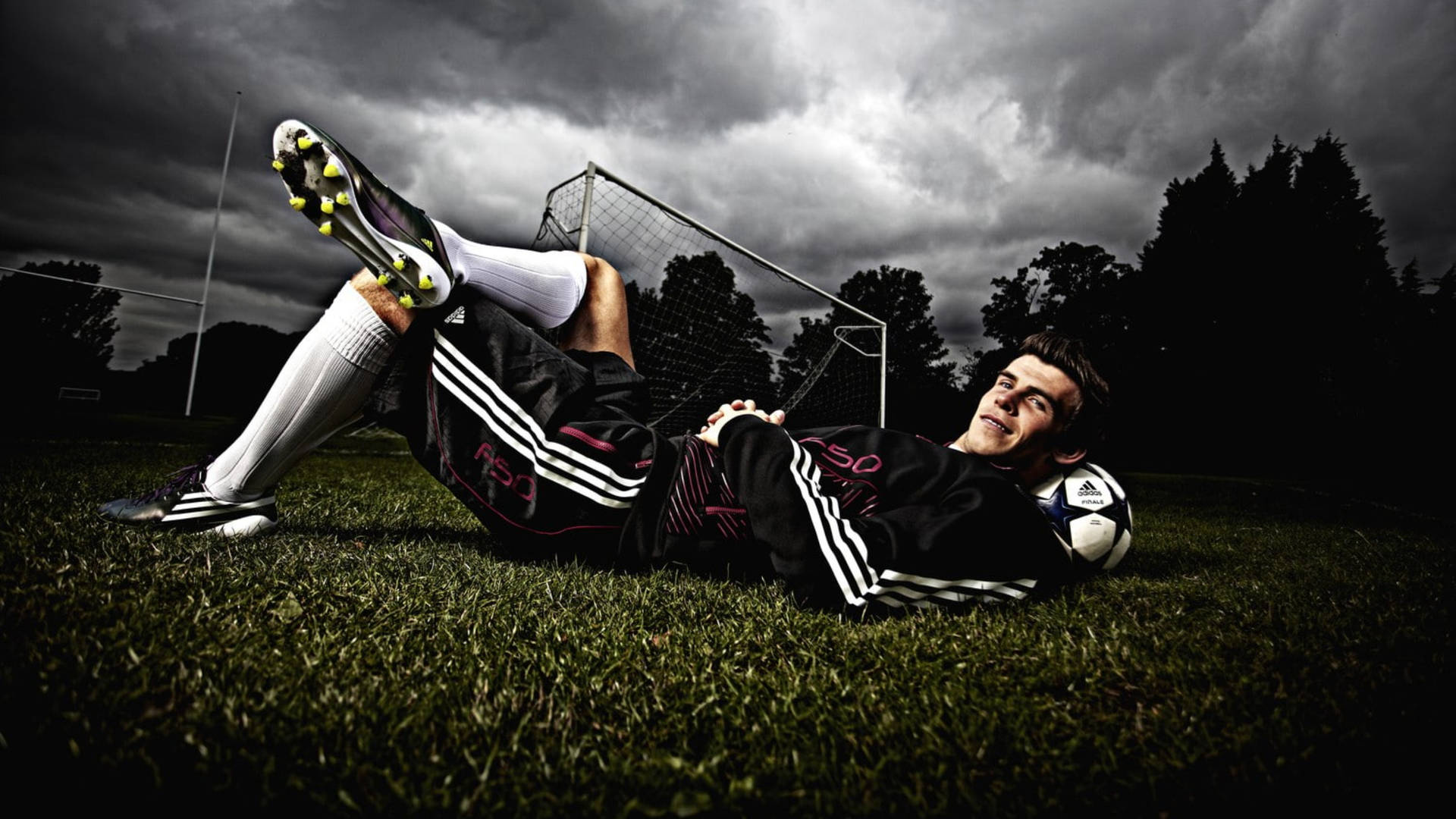 Gareth Bale Lying In Field Background