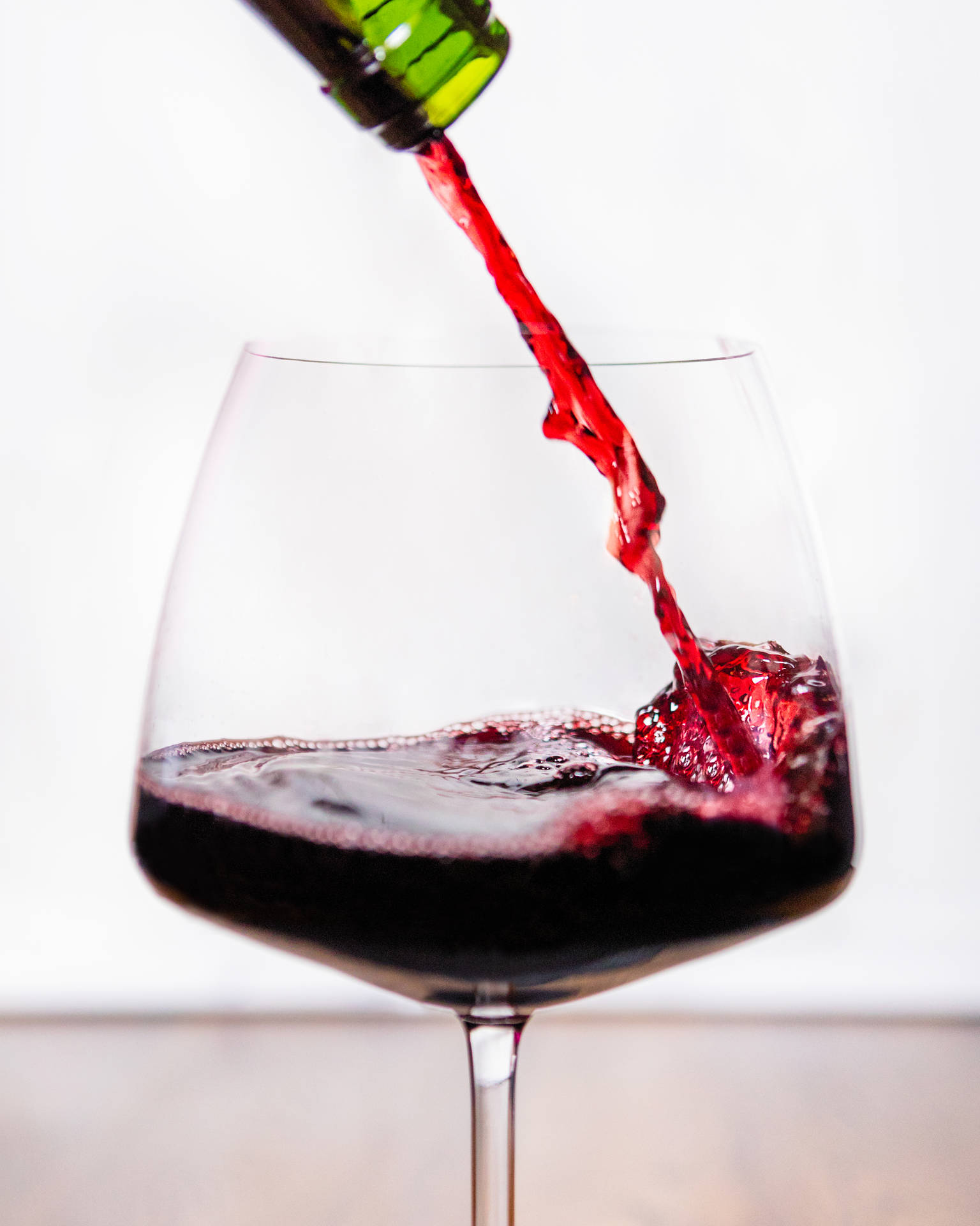 Garnet Wine On Glass Background