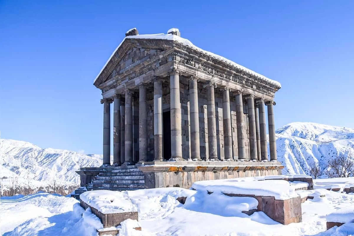 Garni Temple Covered In Snow Background