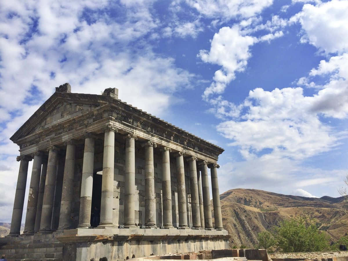 Garni Temple Under Cloudy Sky Background