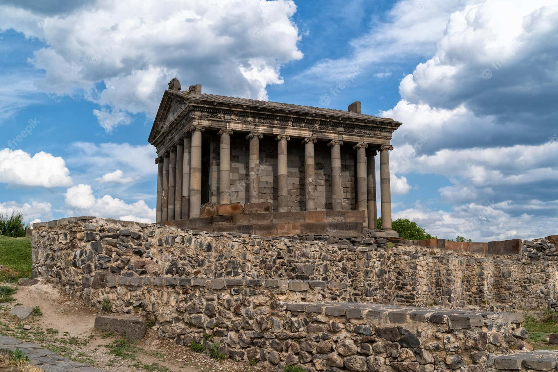 Garni Temple With Rock Wall Background