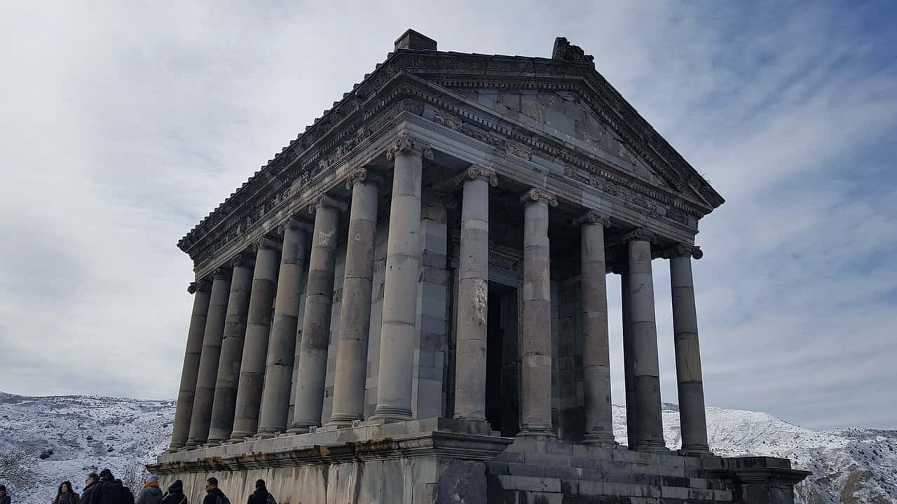 Garni Temple With Snowy Mountains Background