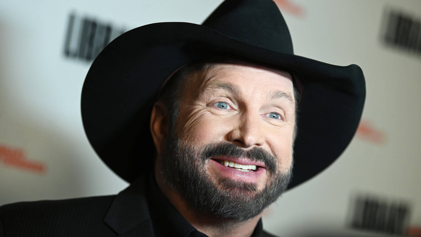 Garth Brooks Smiling Cheerfully Background