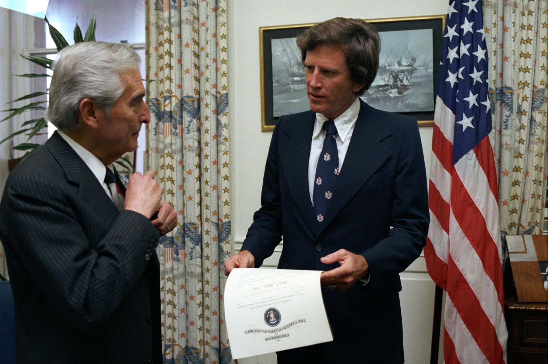 Gary Hart Conversing With Edward Hidalgo Background