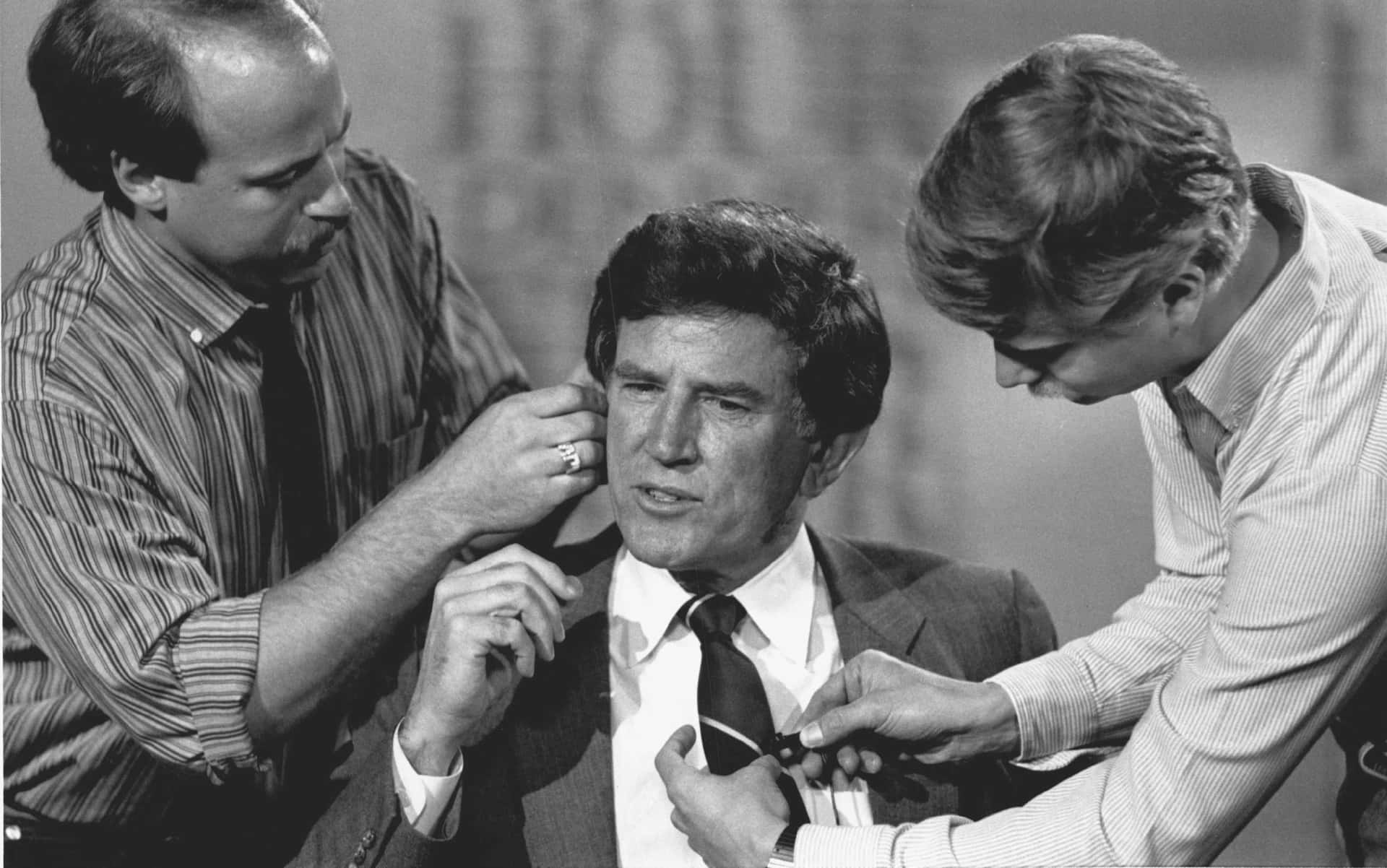 Gary Hart Interacting With Production Assistants Background