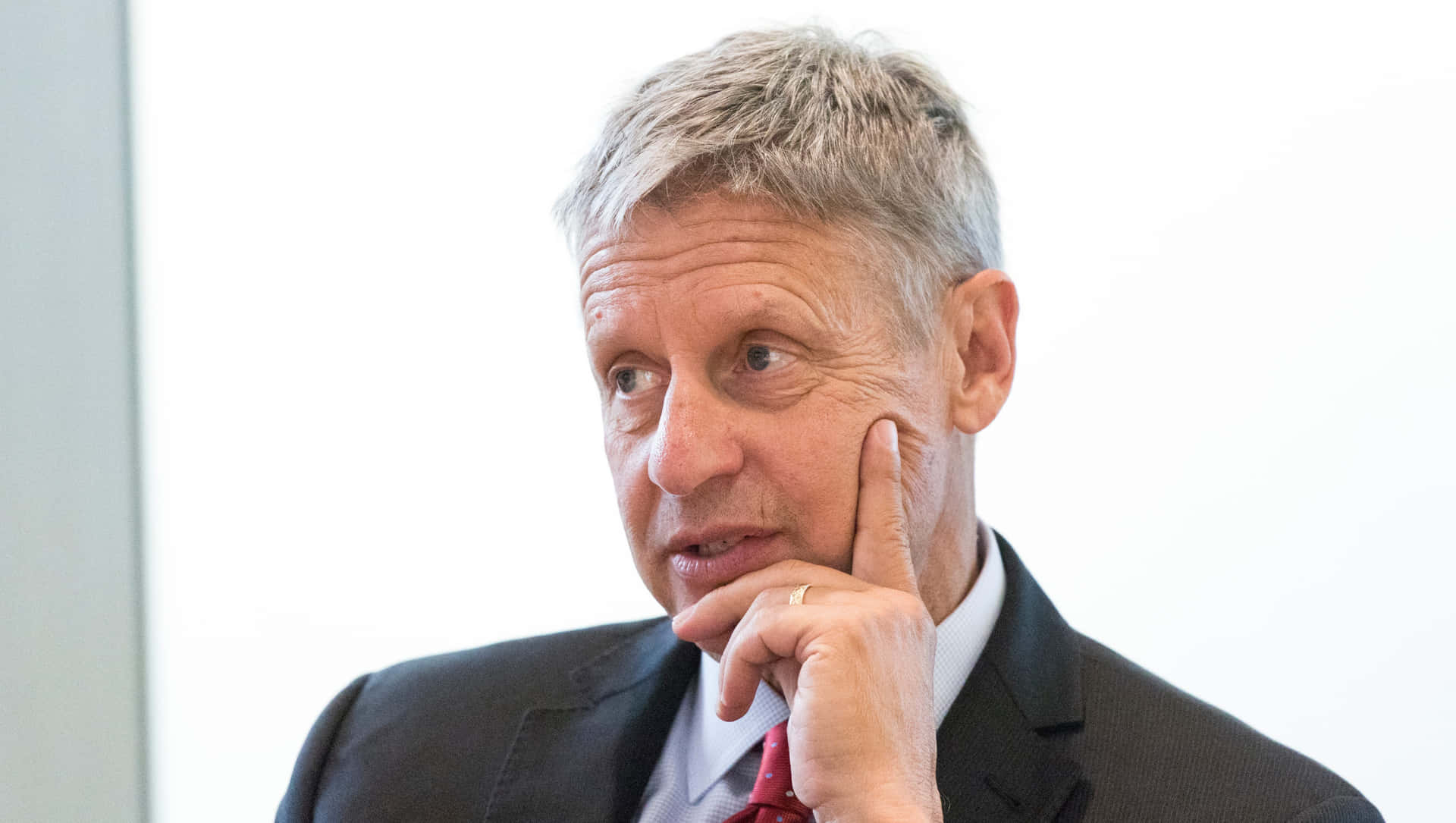Gary Johnson In A Suit With White Backdrop Background