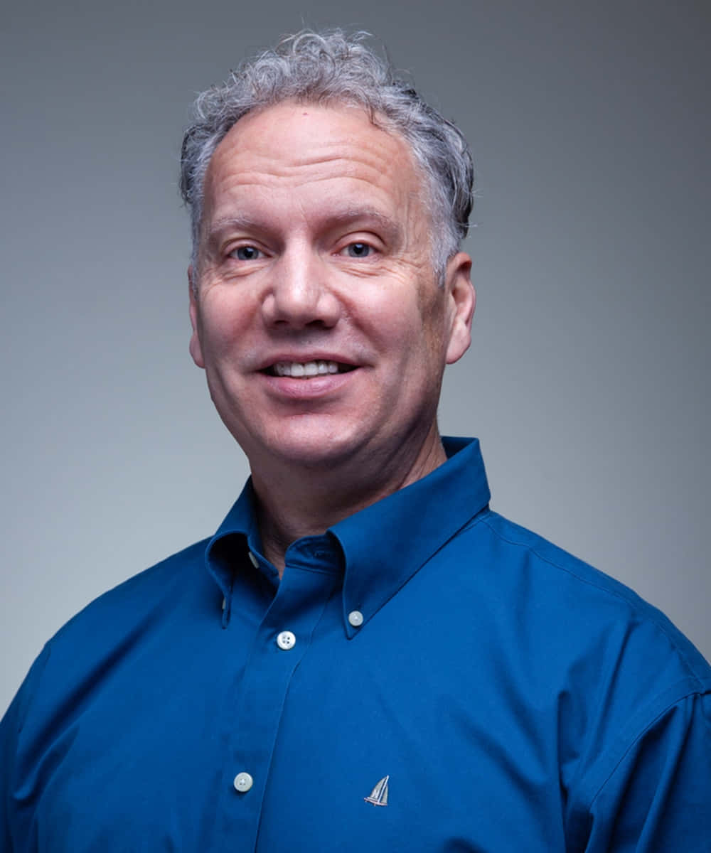Gary Johnson In Blue With A Gray Backdrop Background