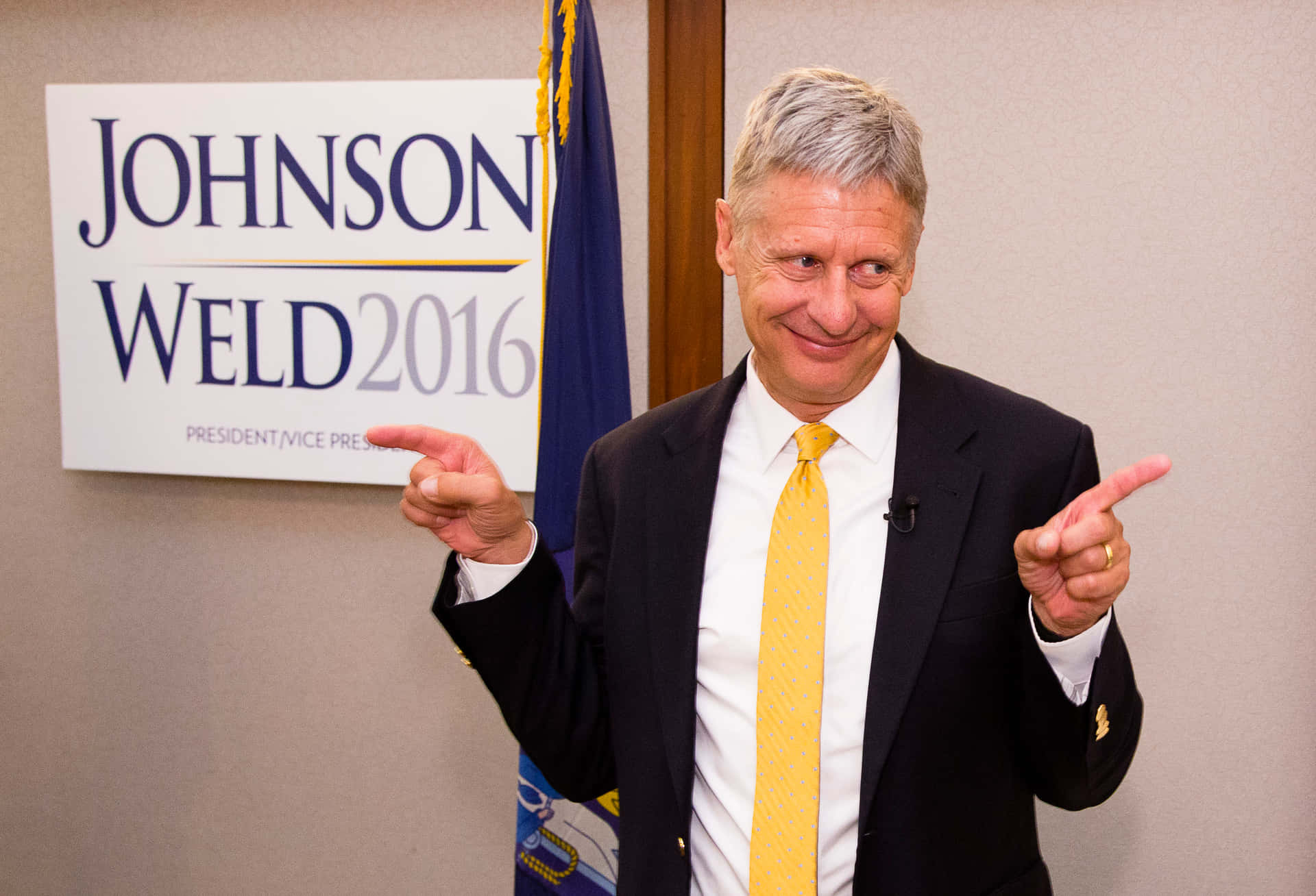 Gary Johnson Pointing In Two Directions Background