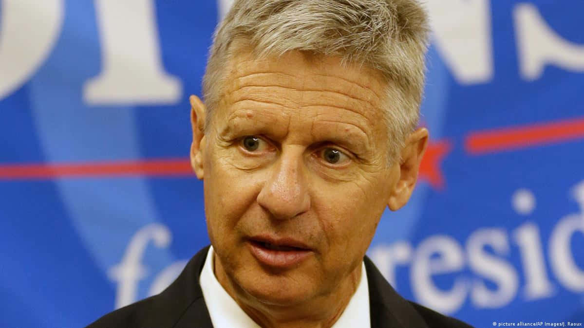 Gary Johnson Speaking At A Promotional Event Background