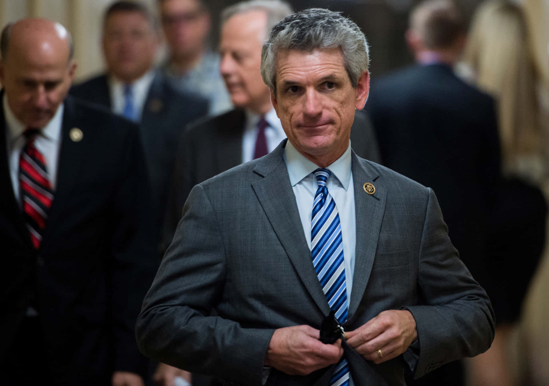 Gary Johnson With Gray Suit And Blue Tie Background
