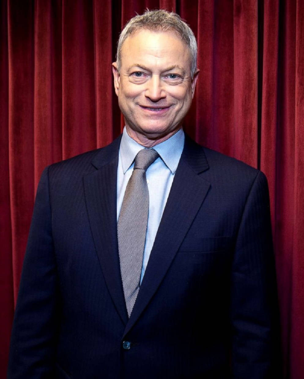 Gary Sinise Wearing Blue Suit Background