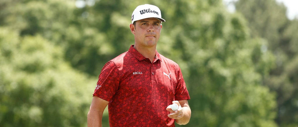 Gary Woodland Clinching His Prestigious Golf Trophy Background