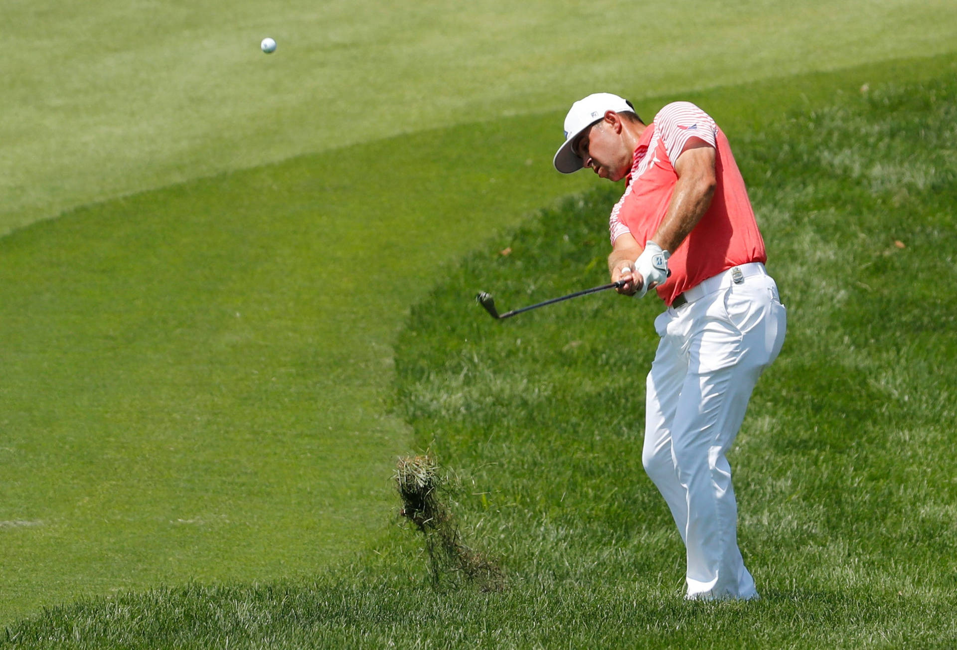 Gary Woodland Hitting Golf Ball Background