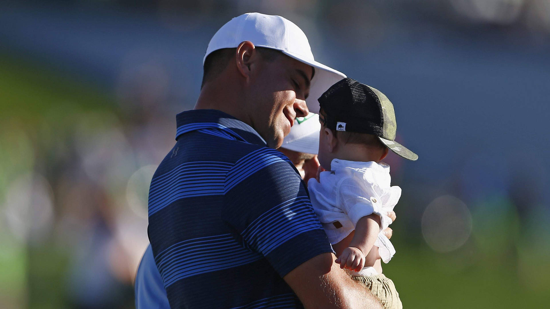 Gary Woodland Holding His Baby Background