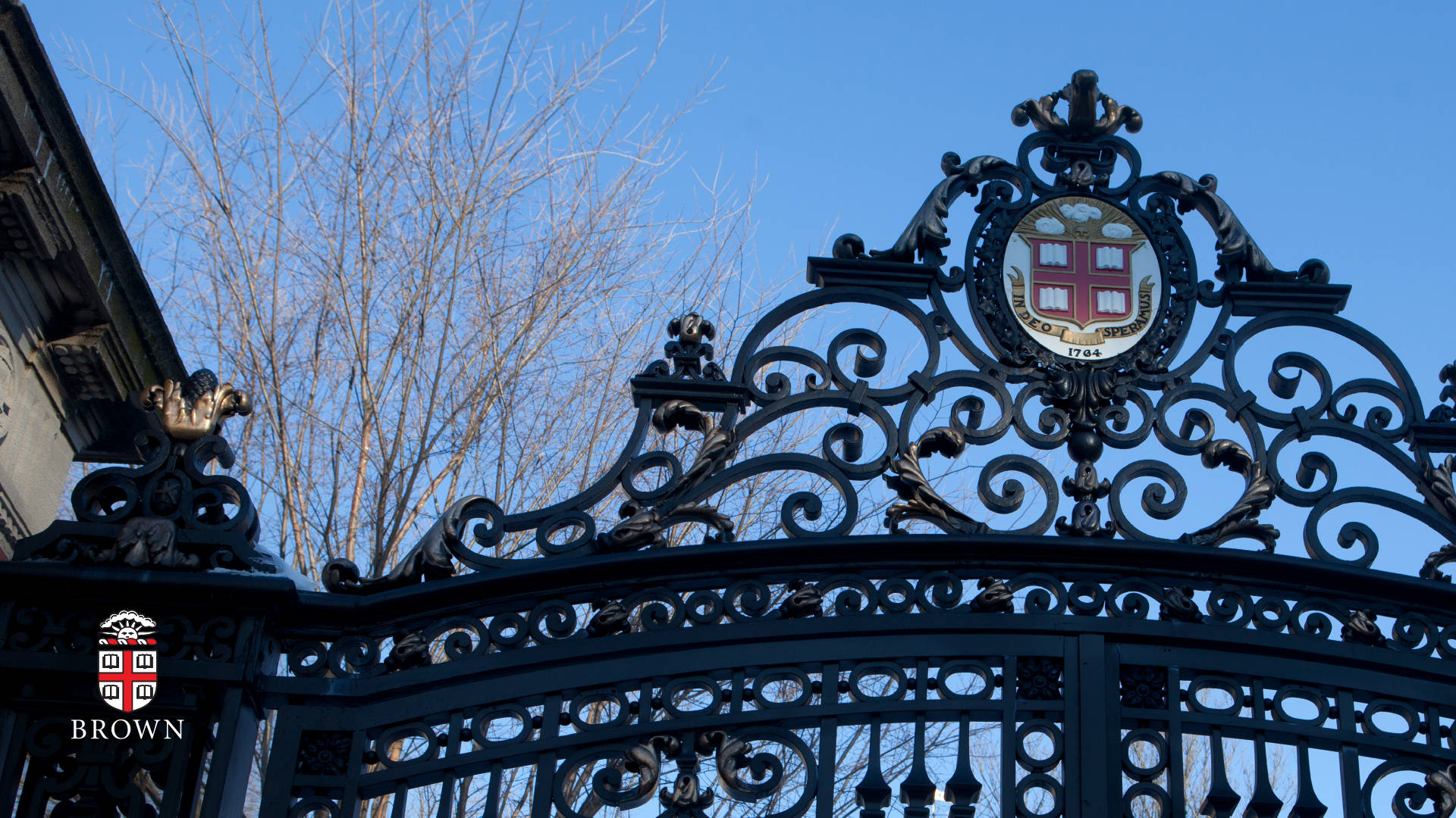 Gate Of Brown University Under Blue Sky Background