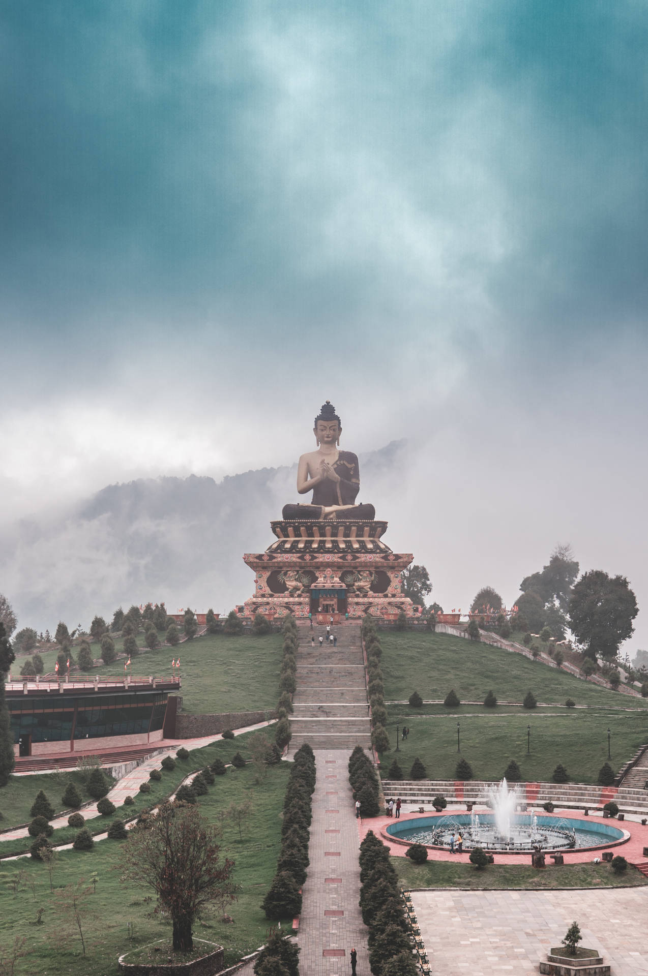 Gautam Buddha Statue On A Hill Background
