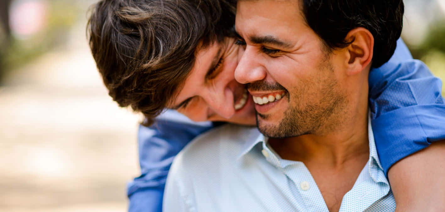 Gay Latino Couple Hugging Background