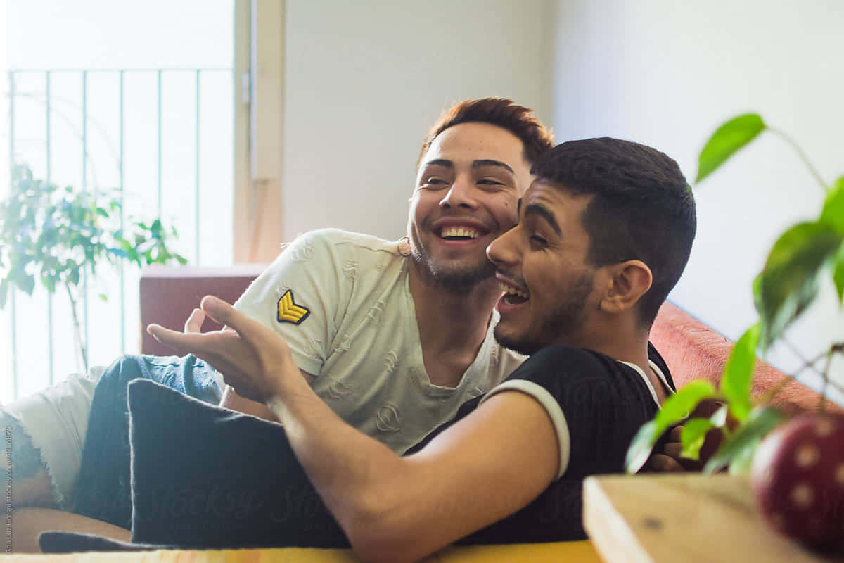 Gay Latino Couple Lounging Background