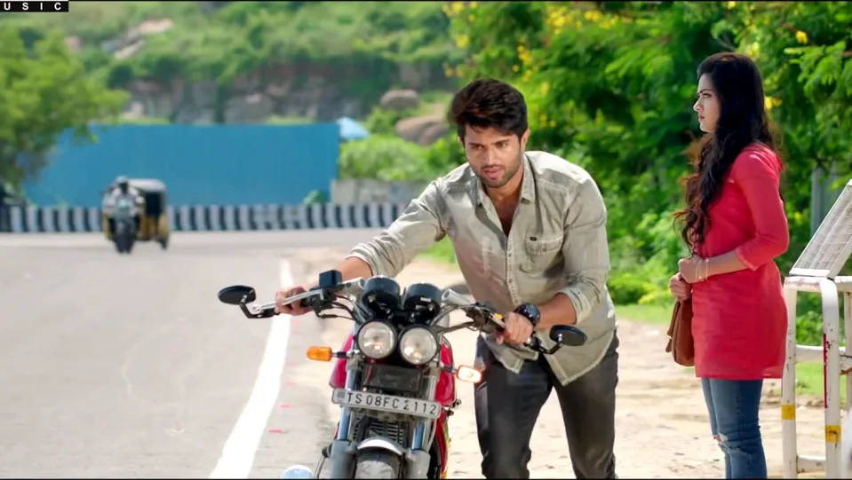 Geetha Govindam Vijay Pushing Motorcycle Background