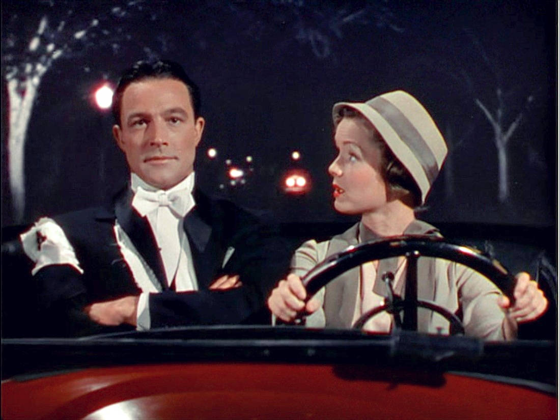 Gene Kelly With A Woman Background