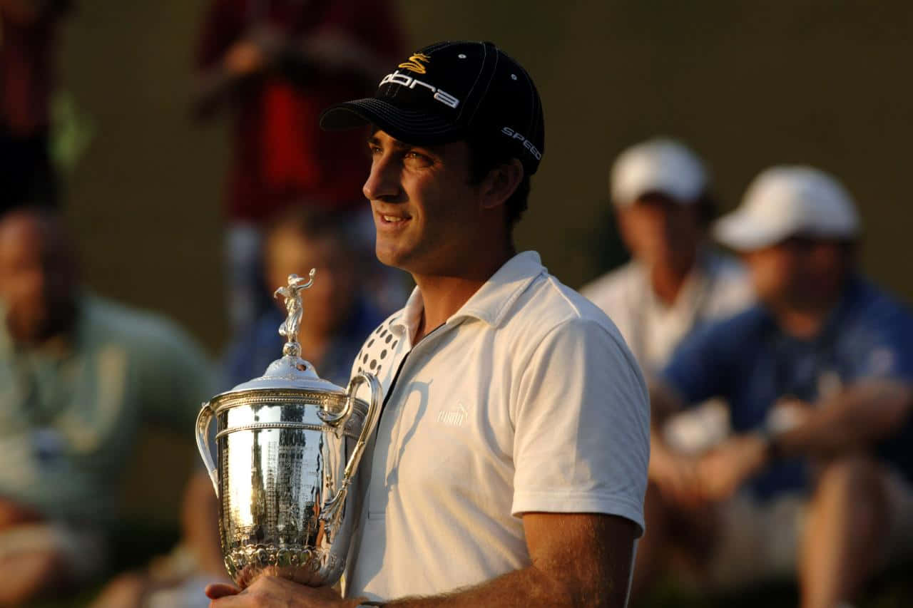 Geoff Ogilvy Holding Trophy Side Profile Background