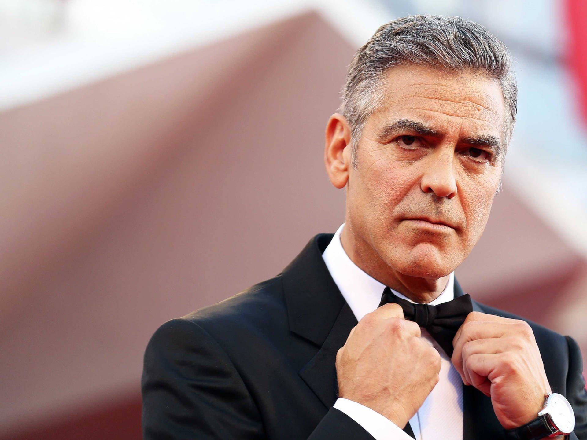 George Clooney Fixing His Bow Tie