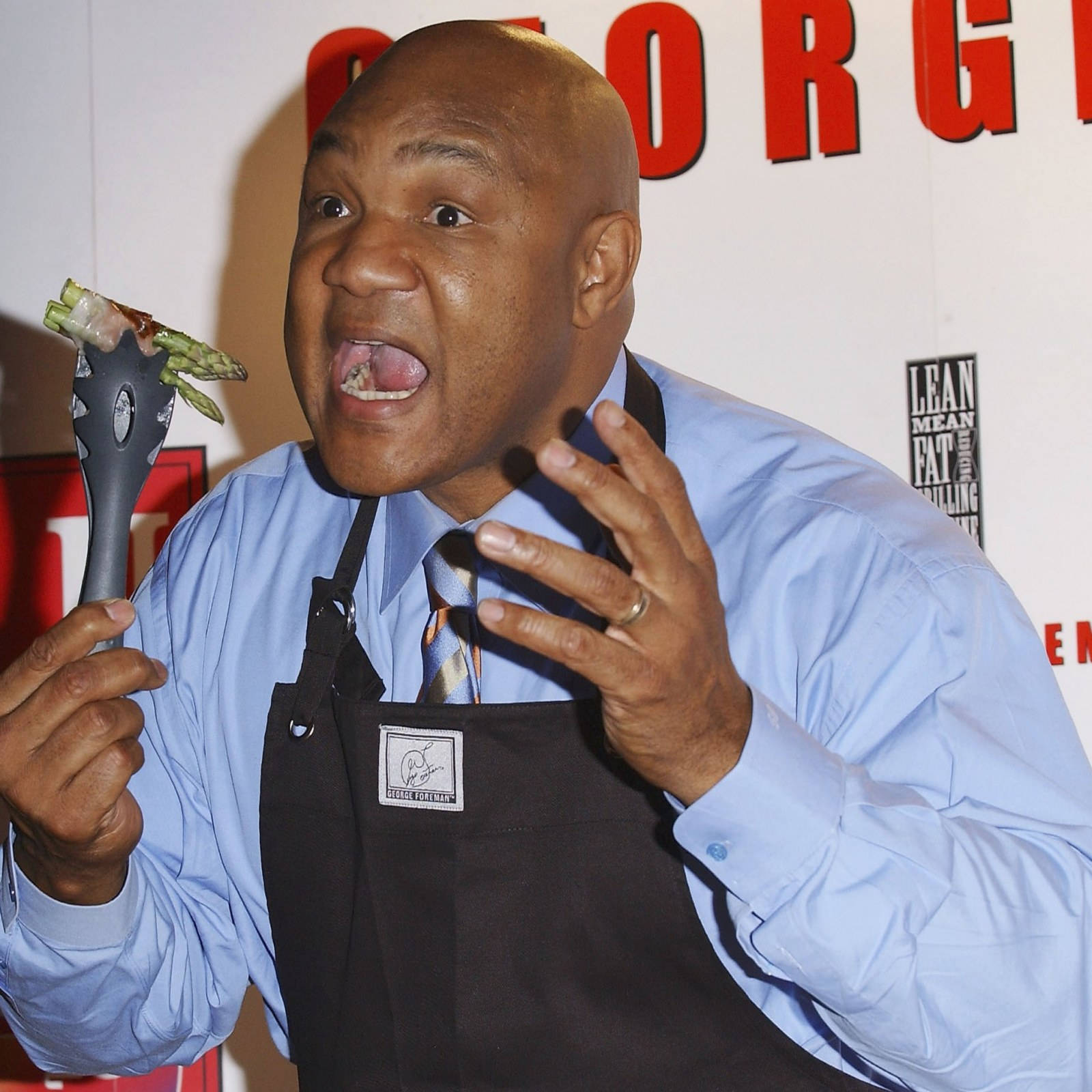 George Foreman Wearing Apron Background