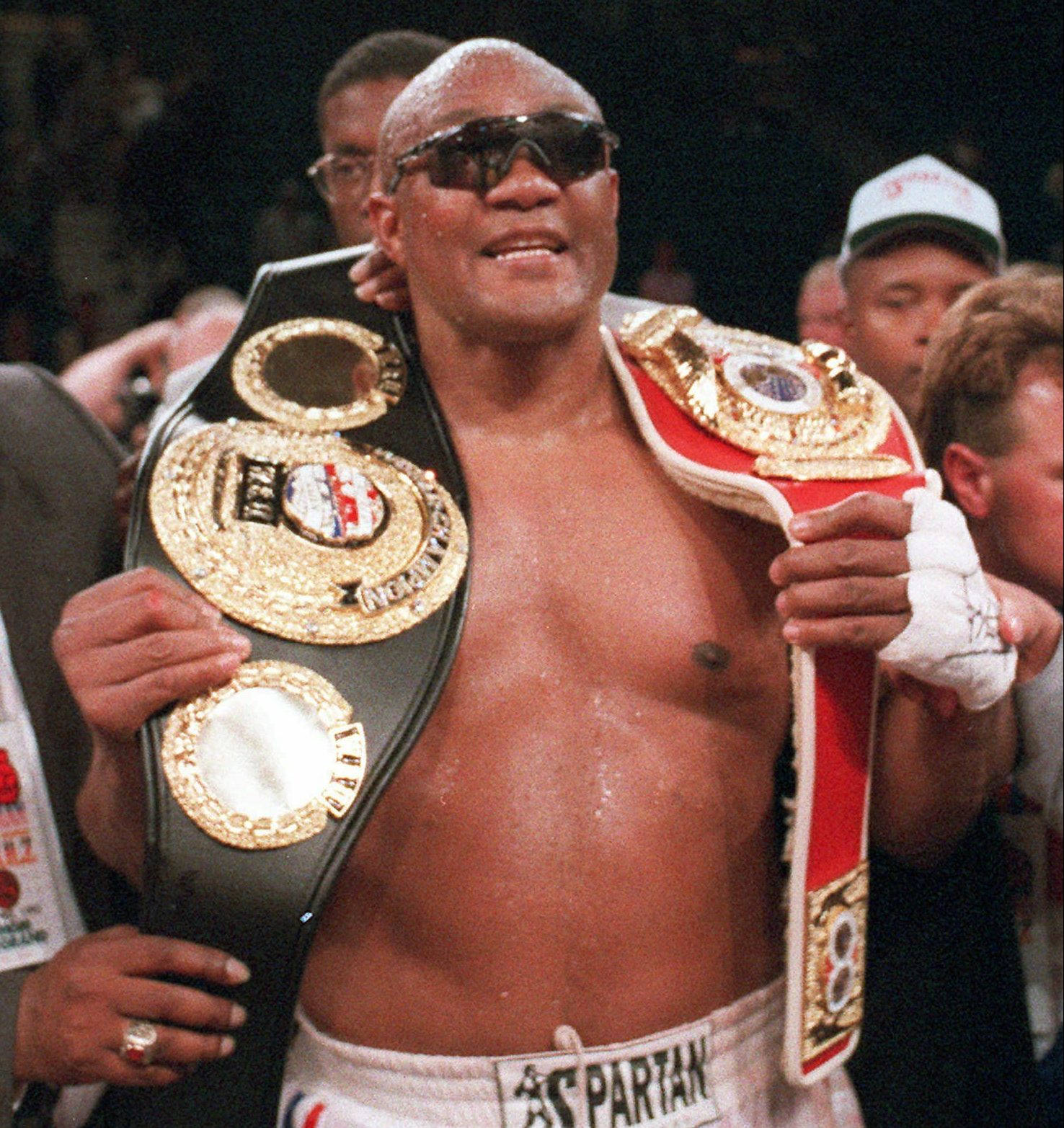 George Foreman With Championship Belts