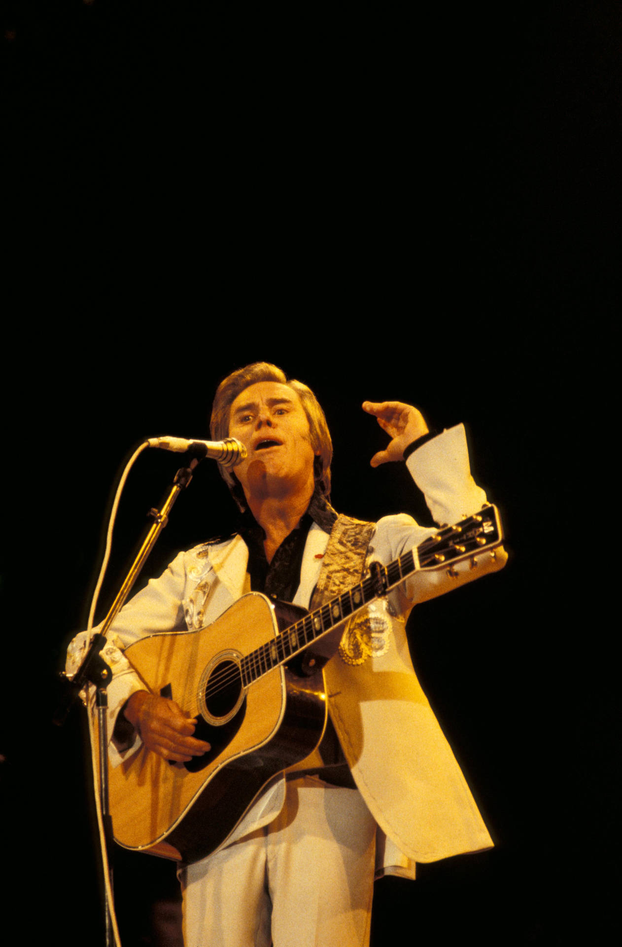 George Jones Passionately Singing In A Live Performance Background