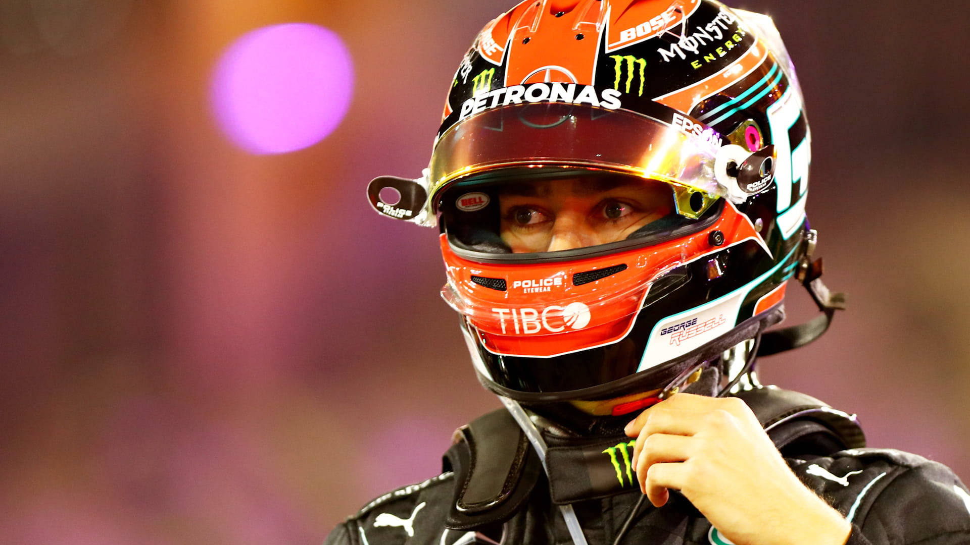 George Russel In Helmet Bokeh Light Background