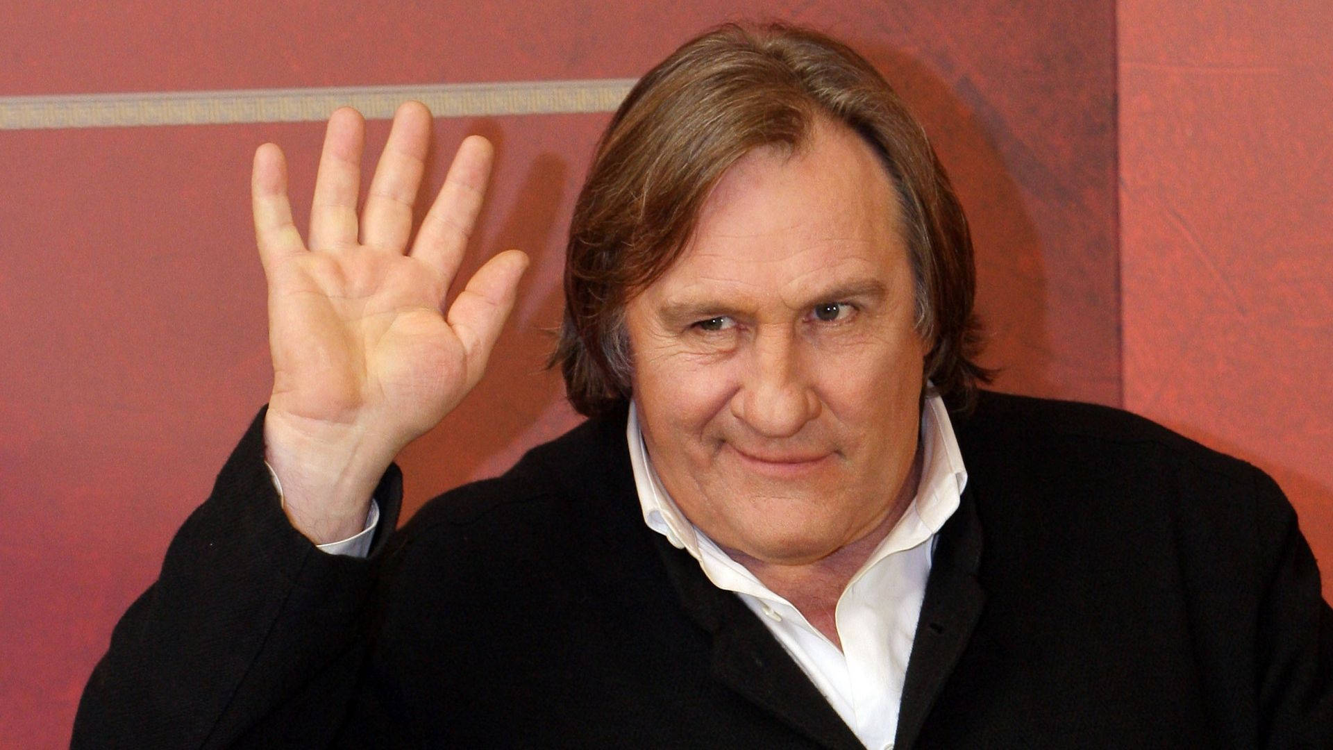 Gérard Depardieu Waving Pink Background