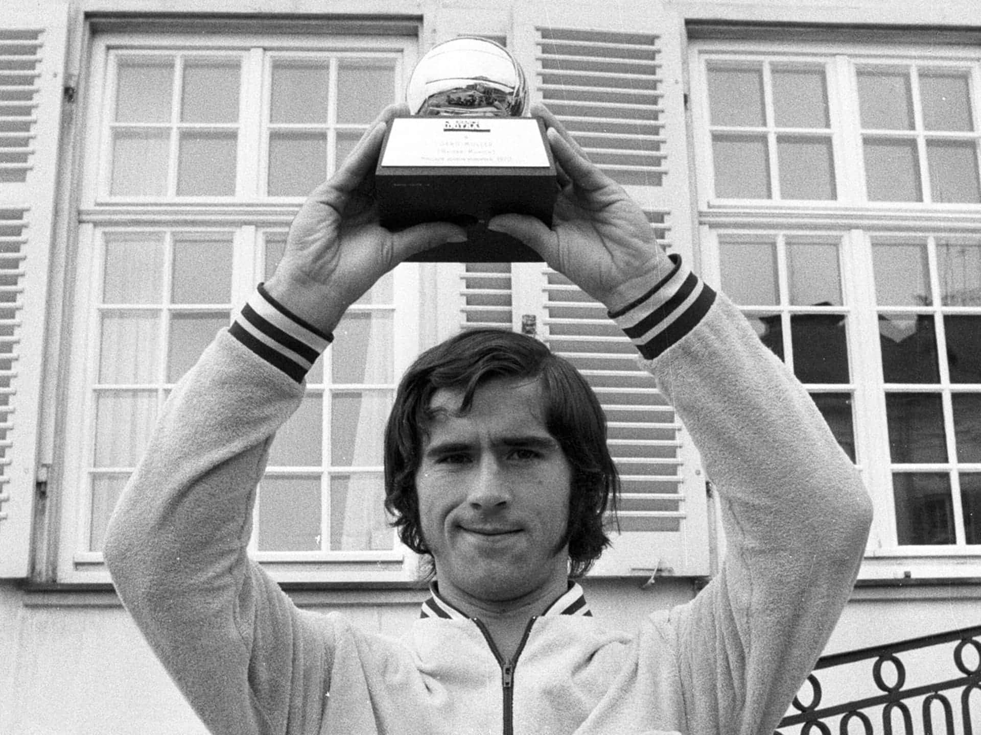 Gerd Muller Holding 1970 Ballon D'or Trophy Background