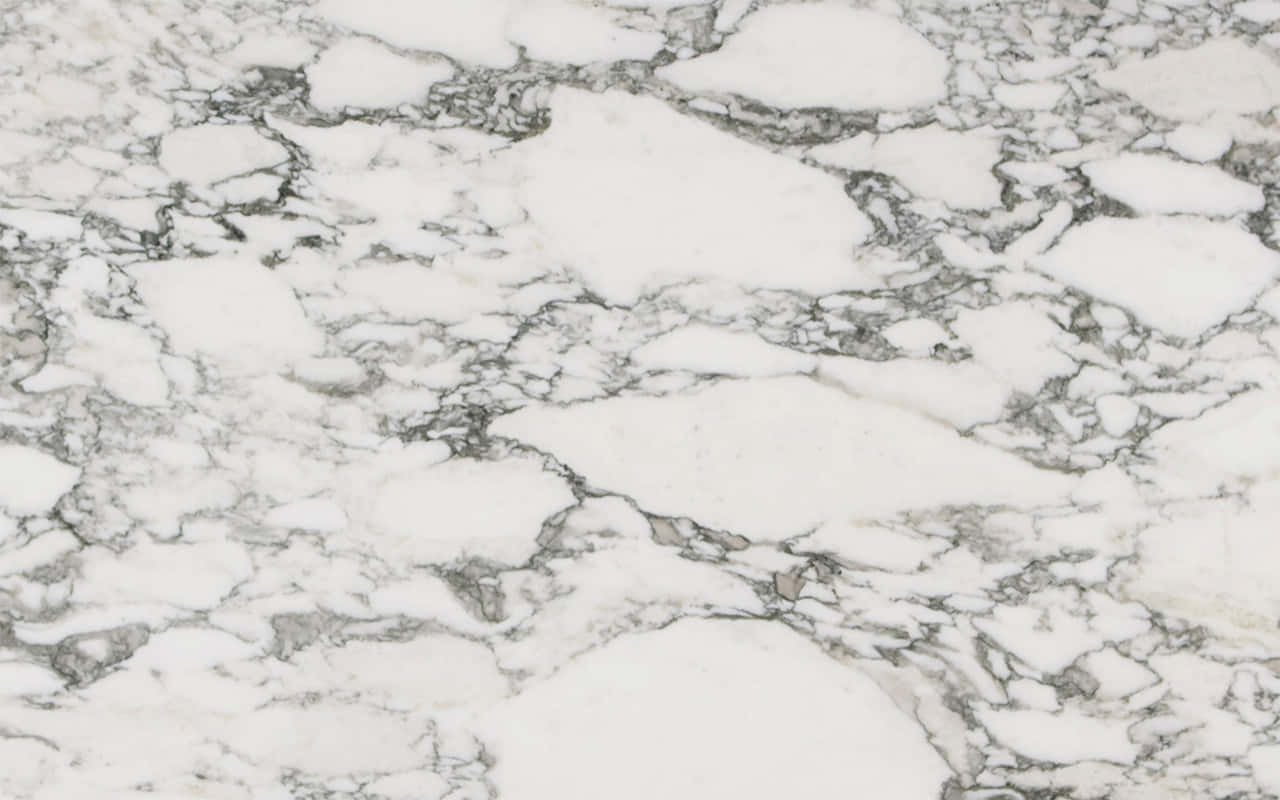 Get A Sleek And Stylish Look With This Timeless Marble Macbook Background
