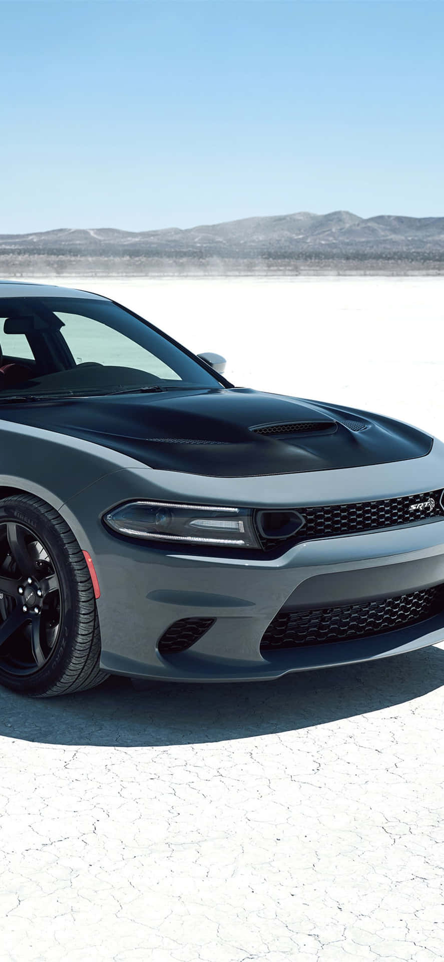 Get Behind The Wheel Of The Iconic Dodge Charger With This Bold Iphone Wallpaper. Background