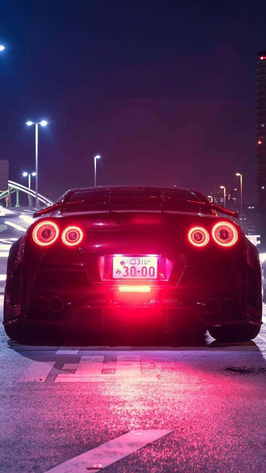 Get Behind The Wheel With The Sleek And Powerful Gtr Iphone Background