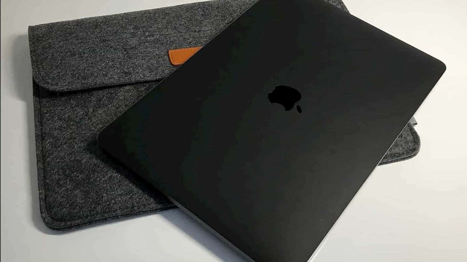 Get Ready For A Professional Experience With The Black Macbook Background