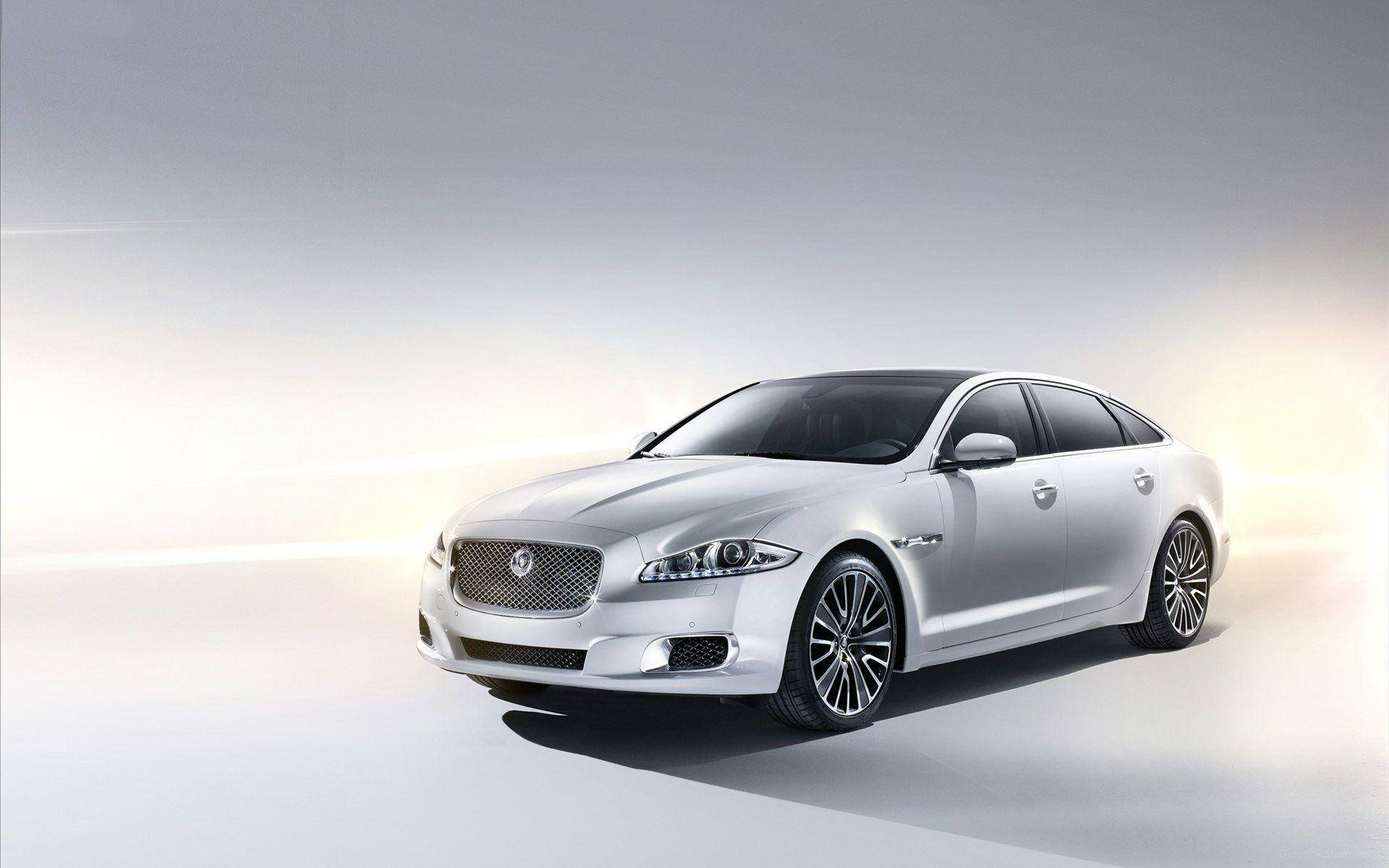 Get Ready For The Road With A Shiny Silver Jaguar Background