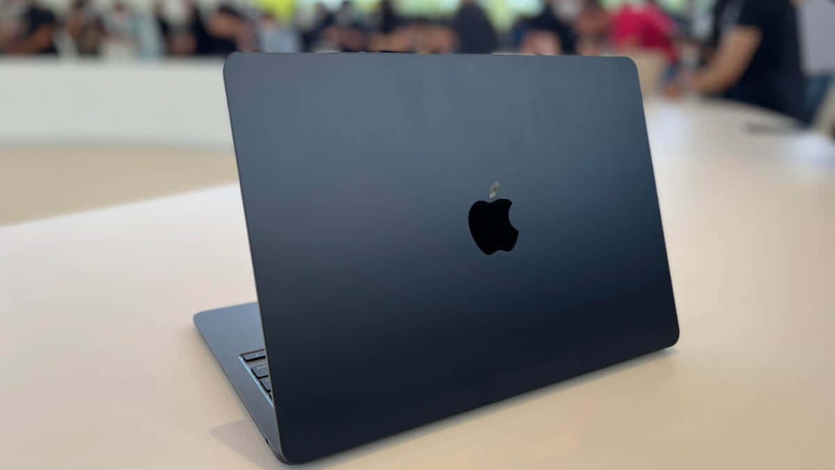 Get Ready To Take On The World With Black Macbook Background