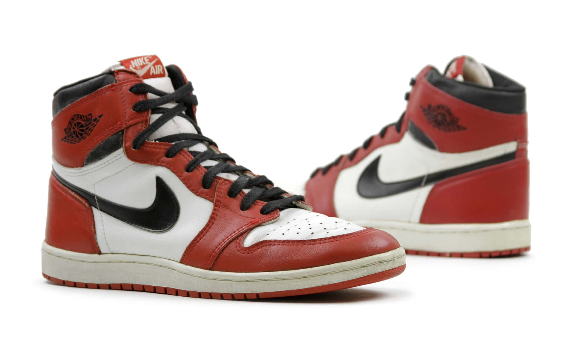 Get That Jumpman Style With These Bold Red Jordan Shoes Background