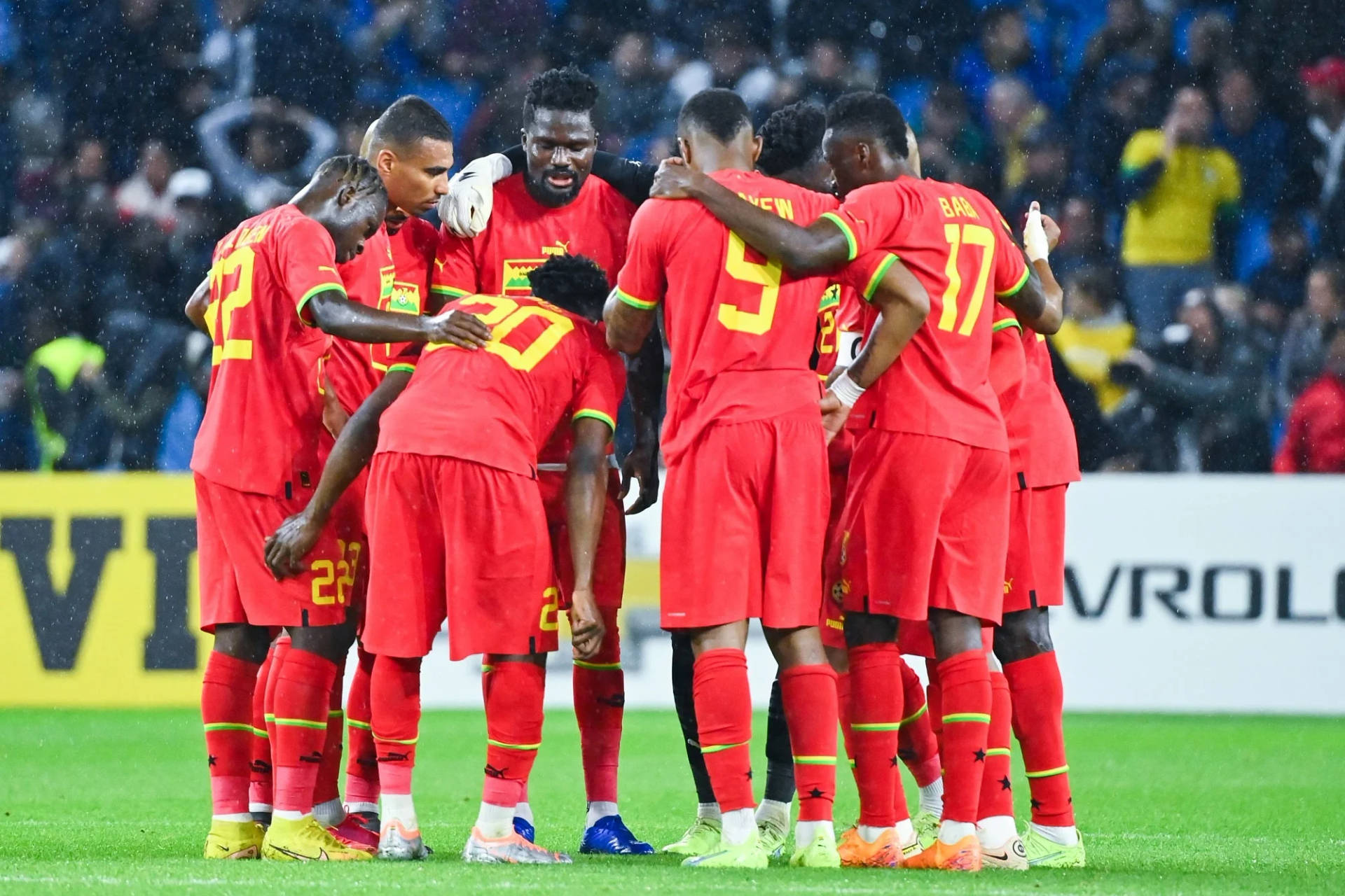 Ghana National Football Team Huddled Background