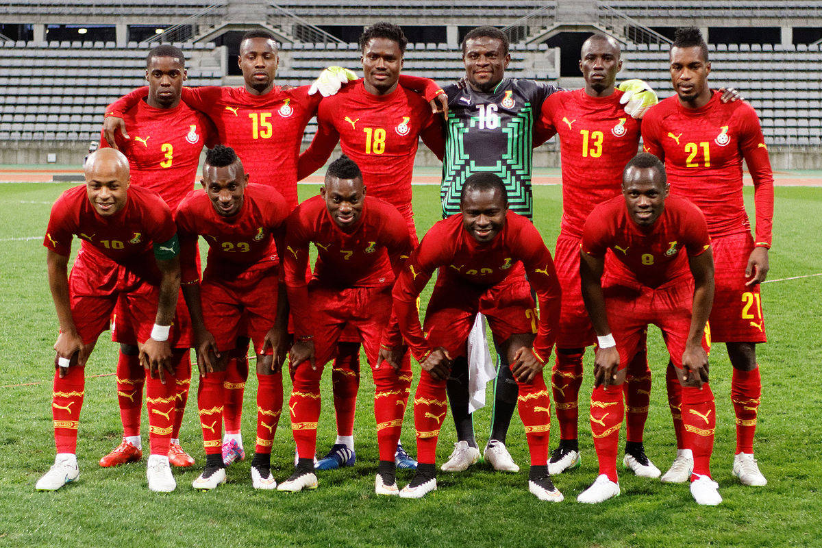 Ghana National Football Team In Red Background