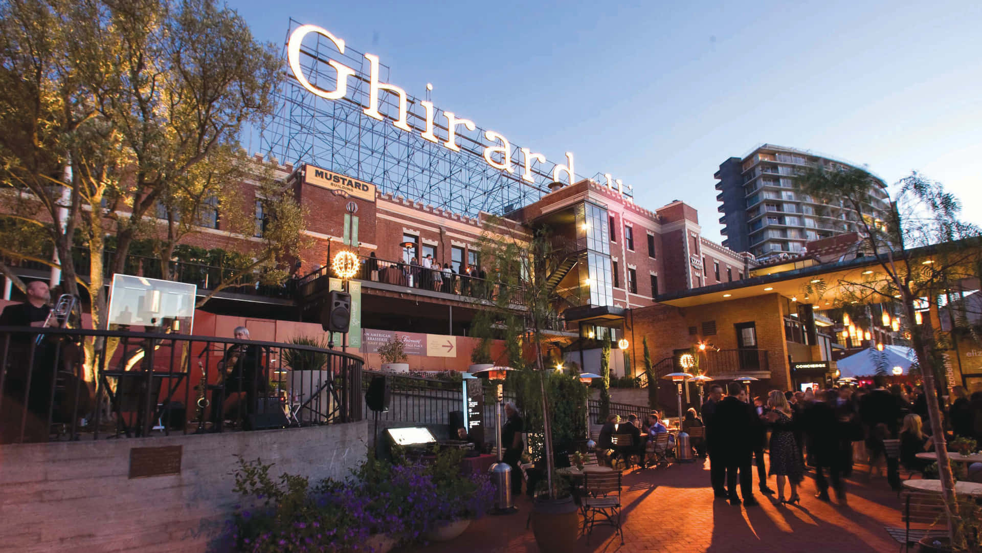 Ghiradelli Square Beneath Blue Afternoon Sky Background