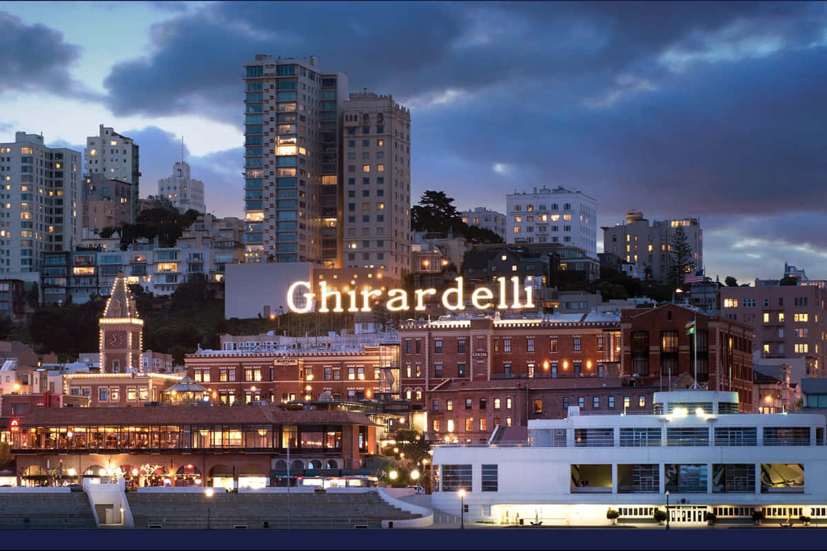 Ghiradelli Square Beneath Cloudy Night Sky Background