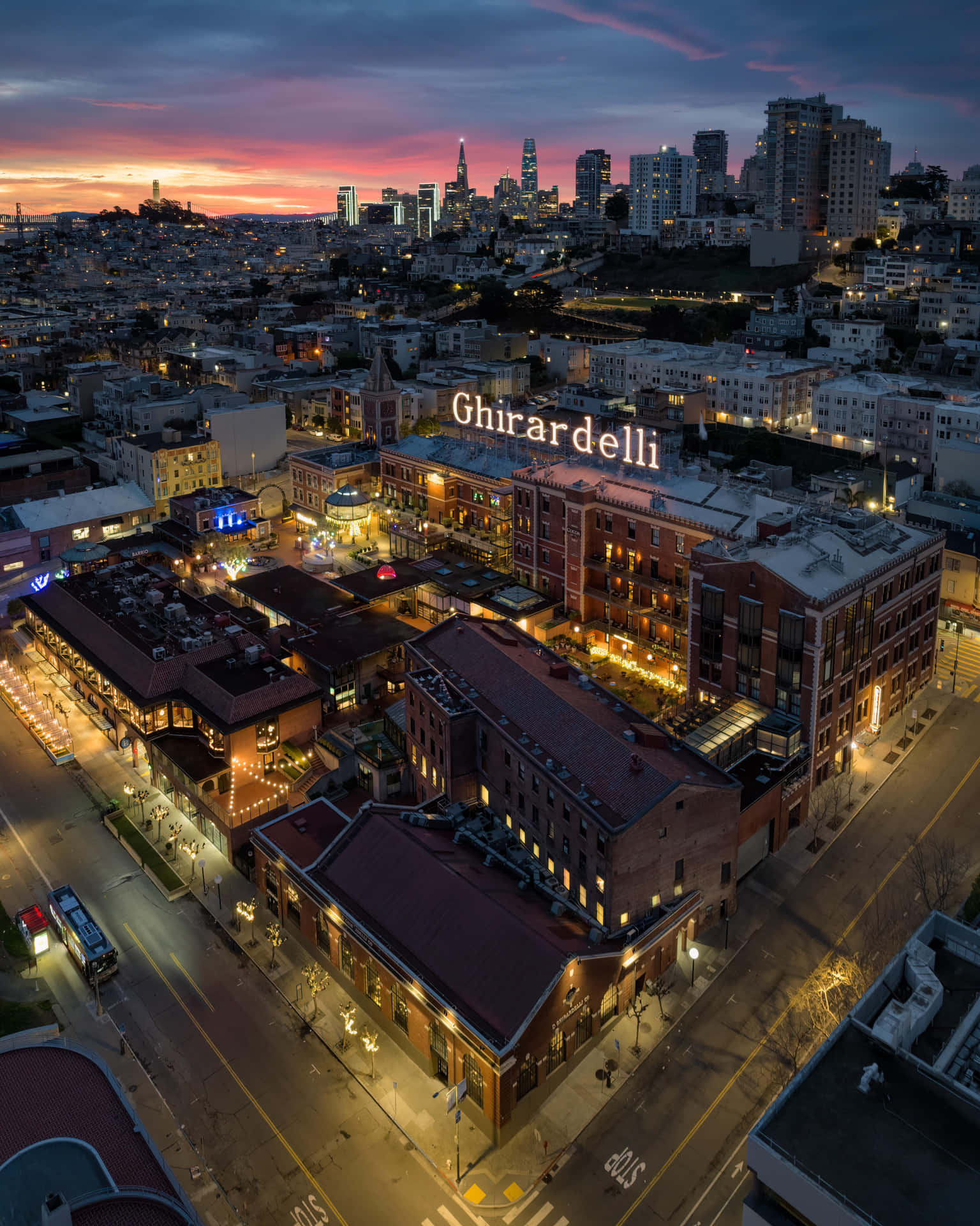 Ghirardelli Square Illuminated At Night Background