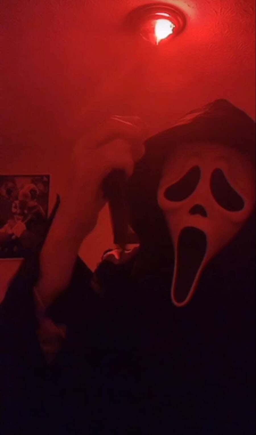 Ghostface Mask Illuminated In Neon Lights Background
