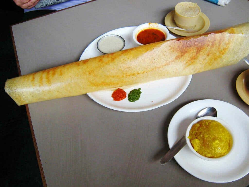 Giant Dosawith Chutneysand Sambar Background