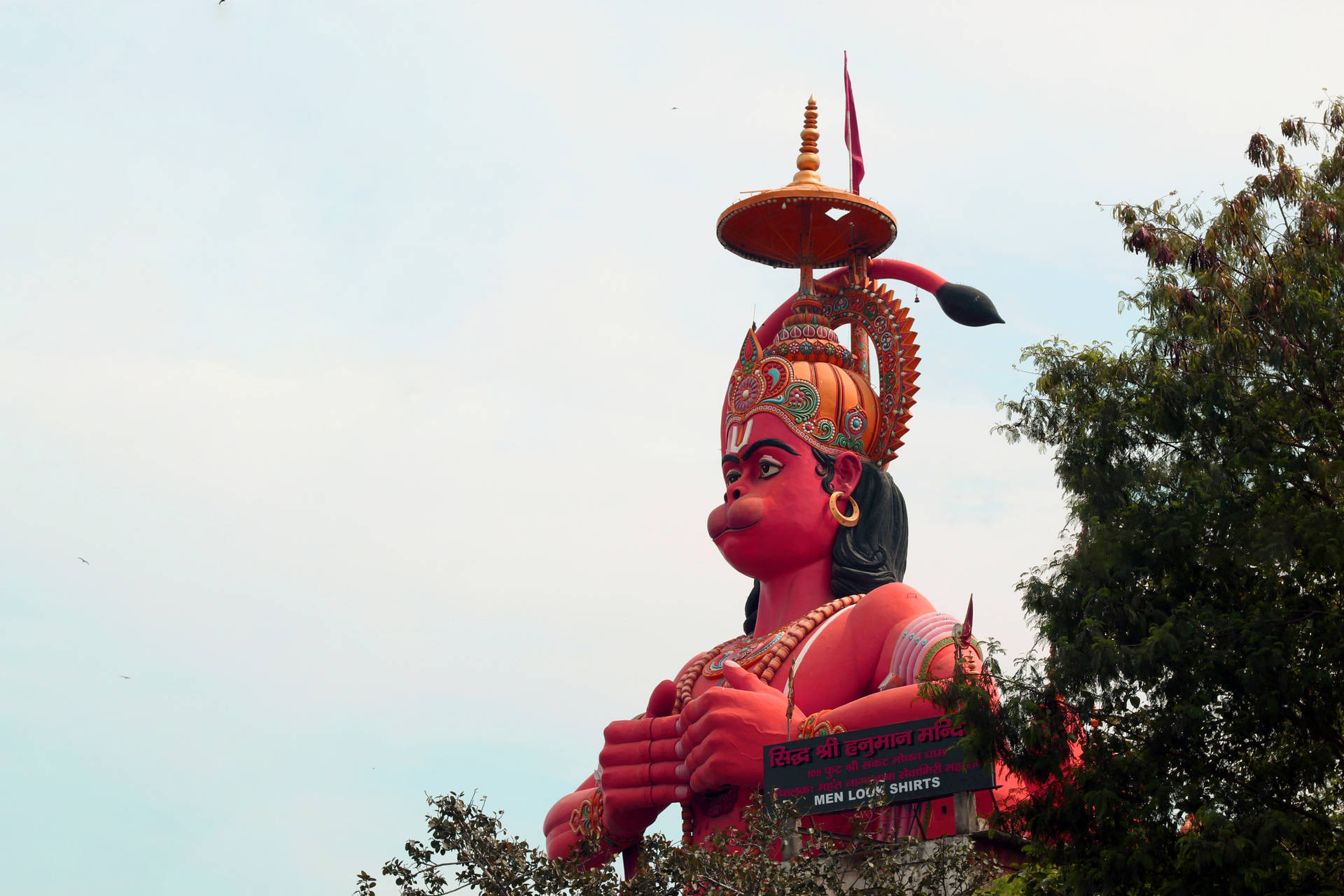 Giant Ram Ji Statue With Trees Background