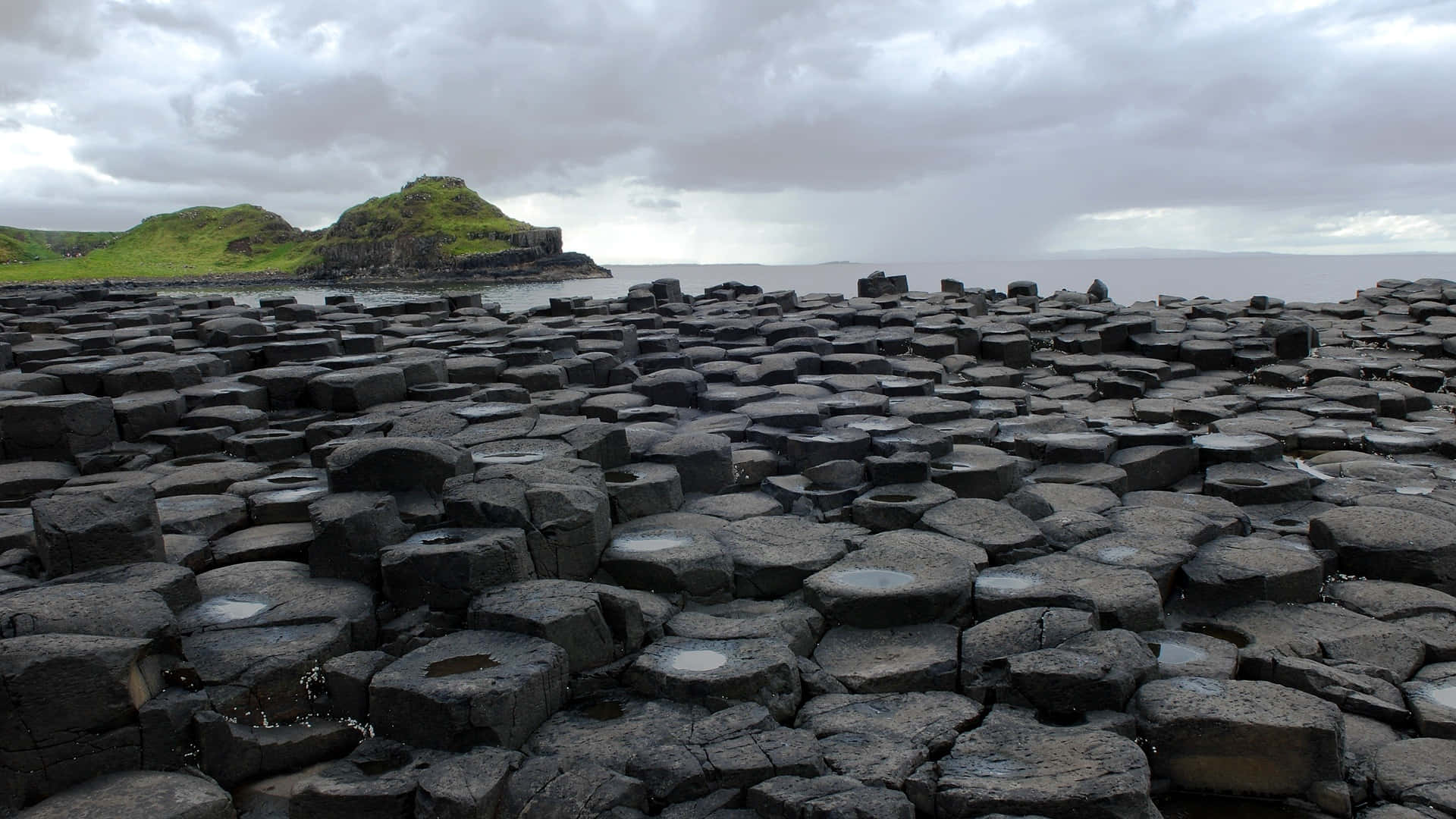 Giant's Causeway Dark Basalt Columns In Northern Ireland Background