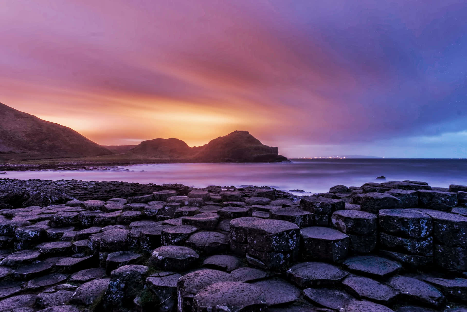 Giant's Causeway Orange Blue Sky Background